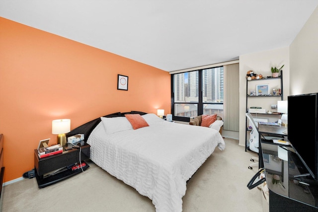 bedroom featuring light carpet