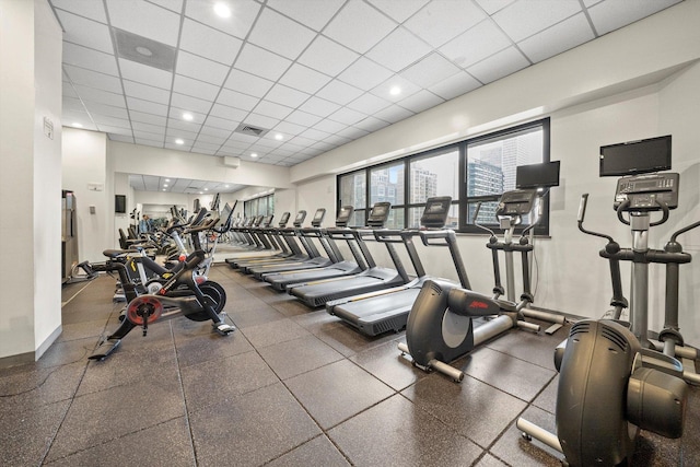 workout area featuring a drop ceiling