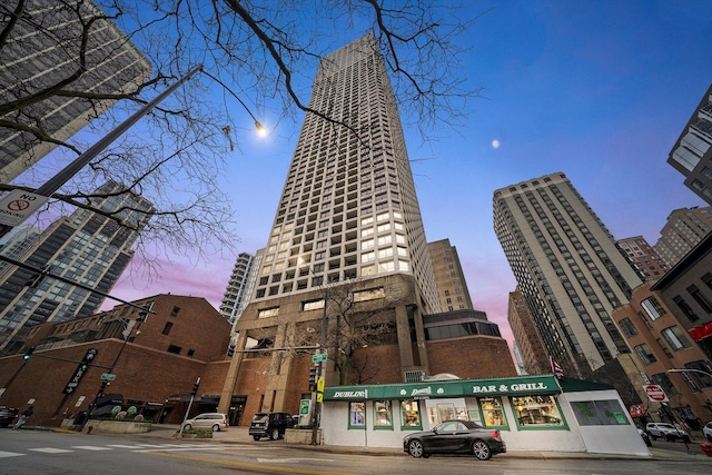 view of outdoor building at dusk