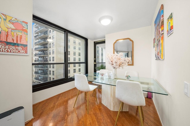 dining area with hardwood / wood-style flooring