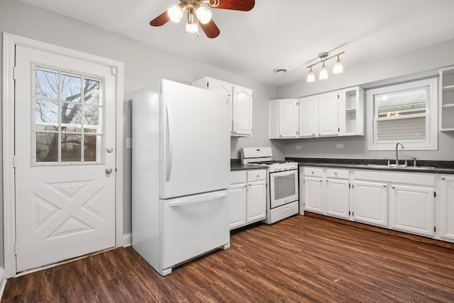 kitchen featuring white appliances, dark hardwood / wood-style floors, sink, and white cabinets