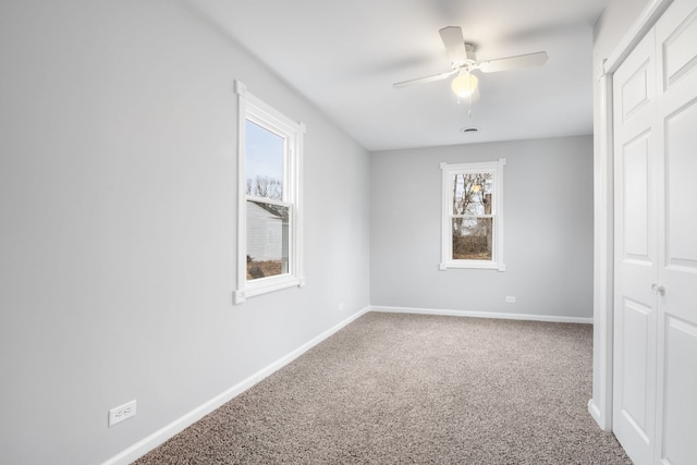 unfurnished bedroom featuring carpet flooring and ceiling fan