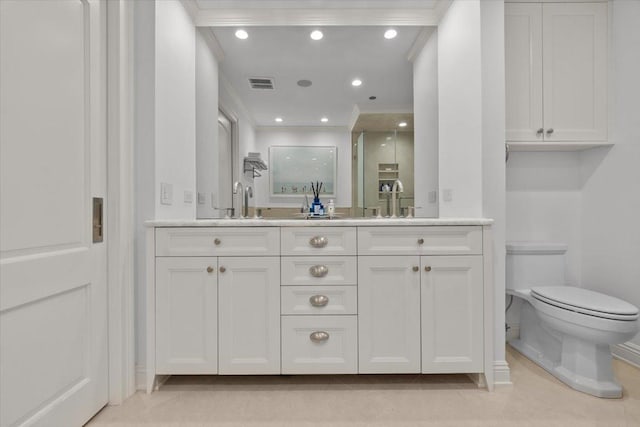 bathroom with toilet, vanity, walk in shower, crown molding, and tile patterned floors