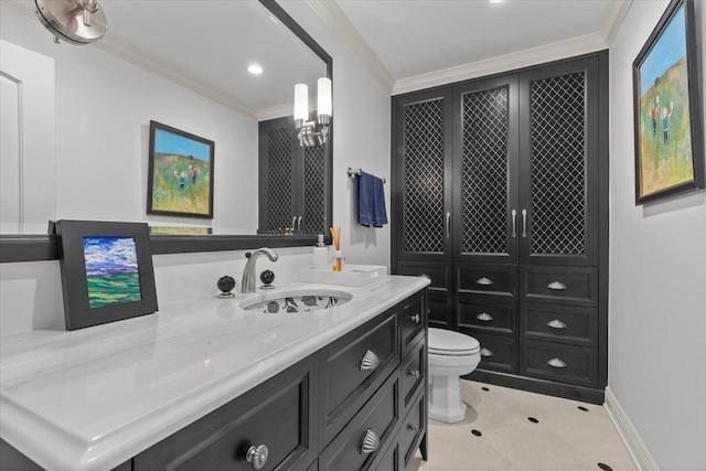 bathroom featuring vanity, crown molding, and toilet