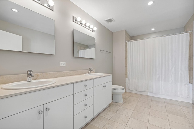 full bathroom with tile patterned flooring, shower / bath combo, vanity, and toilet