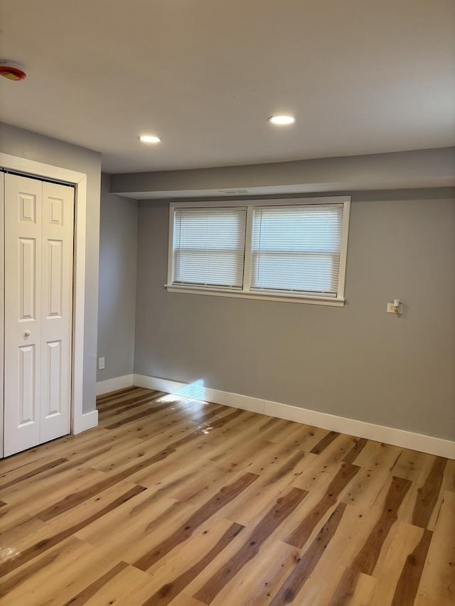 unfurnished room featuring wood walls