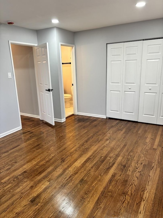 unfurnished bedroom with wood walls