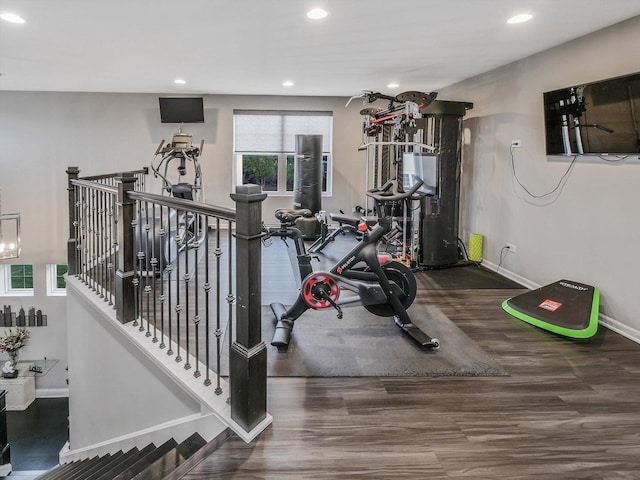 workout area with hardwood / wood-style flooring