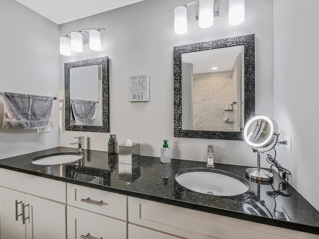 bathroom featuring vanity and a shower