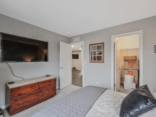 bedroom featuring light colored carpet