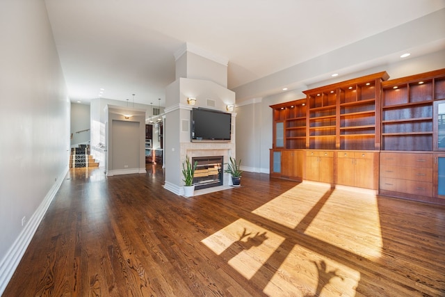 unfurnished living room with dark wood-type flooring