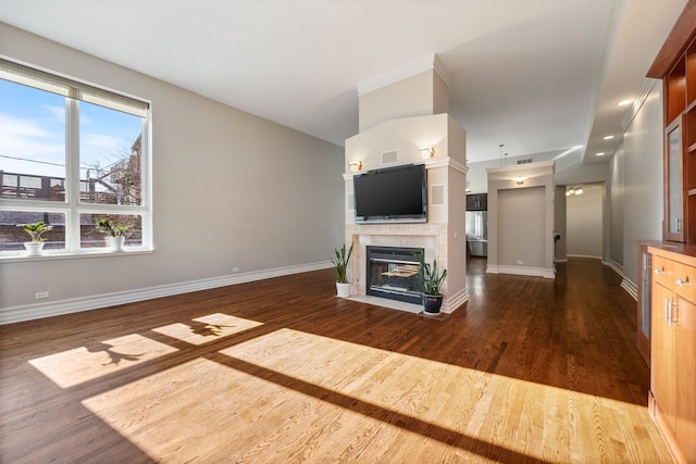 unfurnished living room featuring dark hardwood / wood-style floors and a tile fireplace