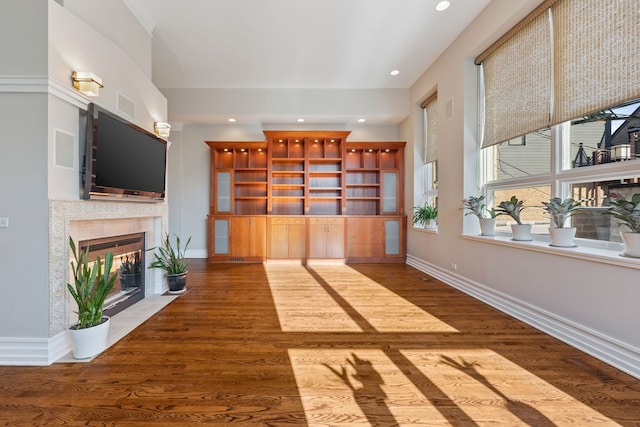 unfurnished living room with dark hardwood / wood-style floors