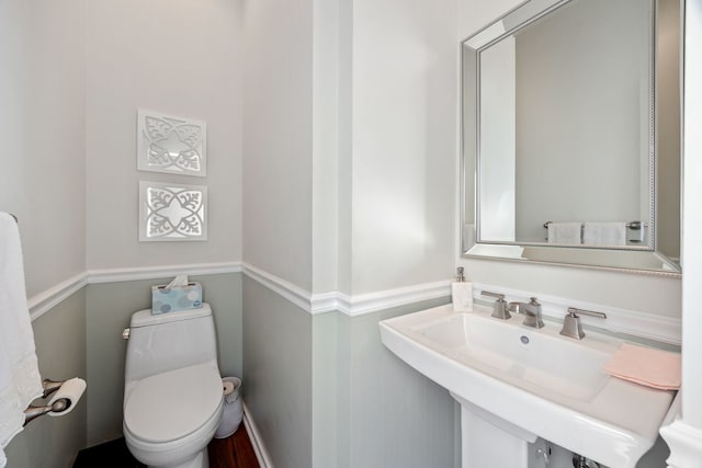 bathroom with toilet and sink