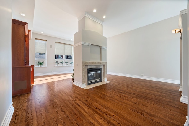 unfurnished living room with wood-type flooring and a fireplace