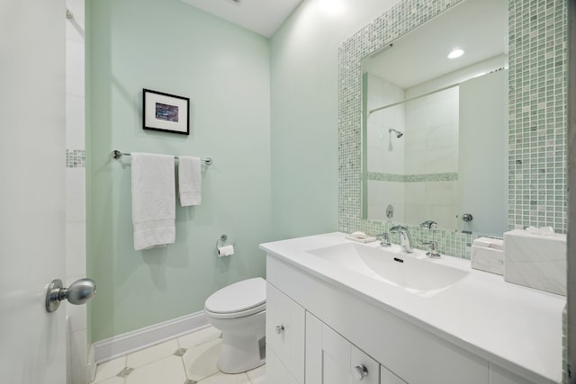 bathroom with vanity, tile patterned floors, and toilet