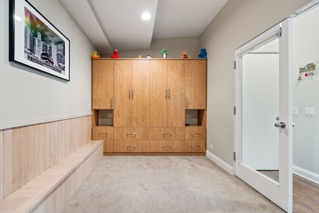 interior space featuring light colored carpet