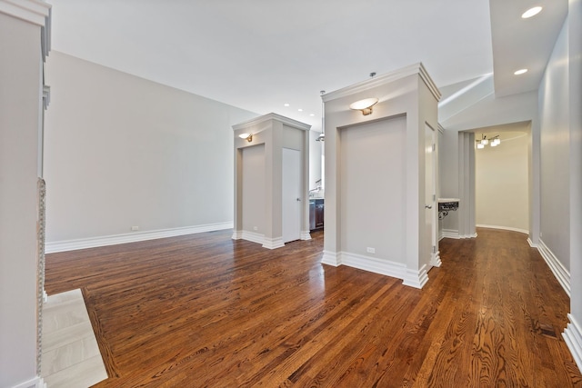 unfurnished living room with dark hardwood / wood-style flooring