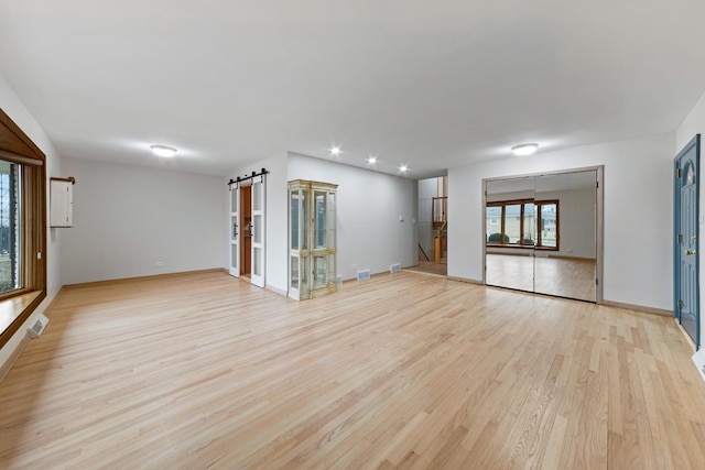 empty room with light hardwood / wood-style floors