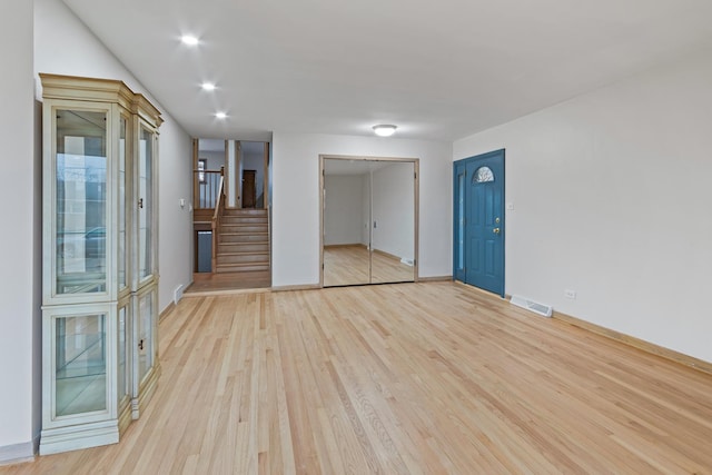 unfurnished room featuring light hardwood / wood-style flooring