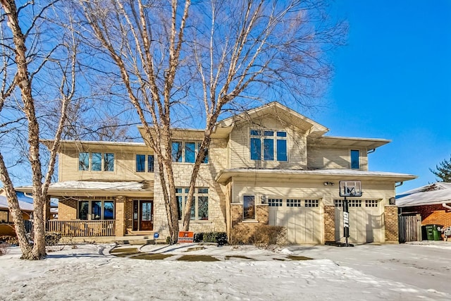 view of front of property with a garage and covered porch