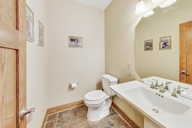 bathroom with toilet and sink