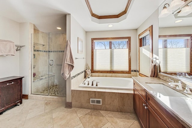 bathroom featuring vanity, crown molding, plus walk in shower, and a healthy amount of sunlight