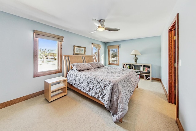 bedroom with ceiling fan and carpet floors