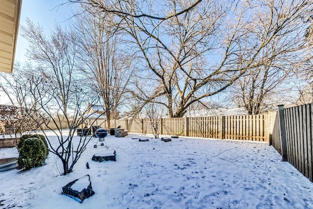 view of yard covered in snow