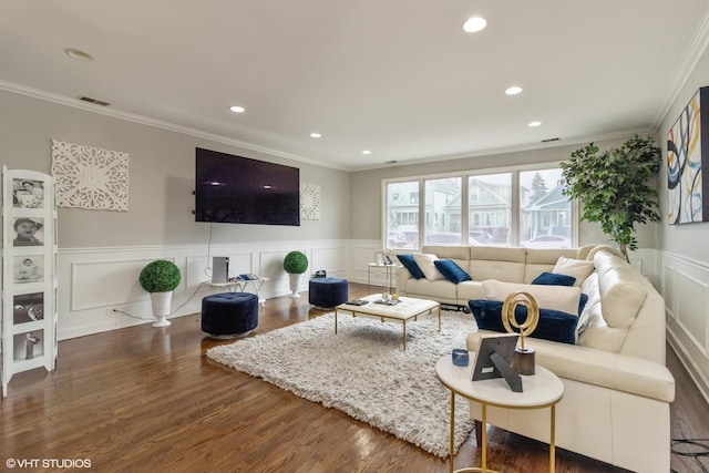 living room featuring crown molding and dark wood-type flooring