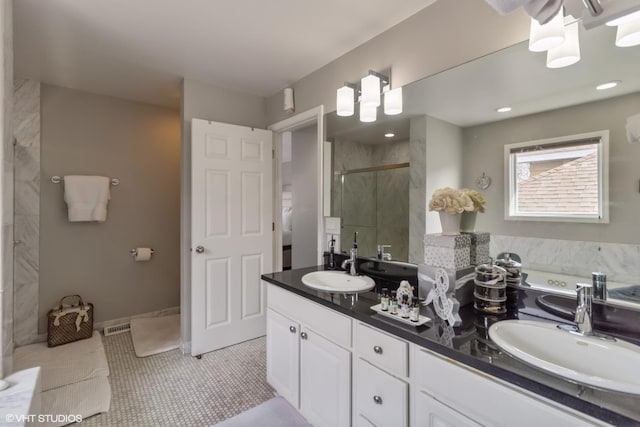 bathroom with vanity and walk in shower