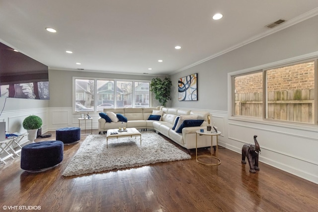 living room featuring ornamental molding and dark hardwood / wood-style flooring