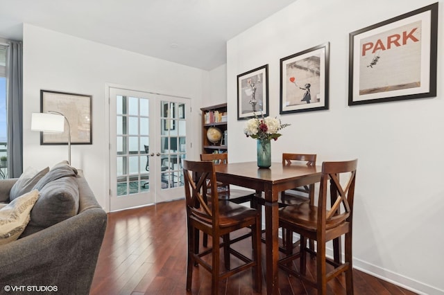 dining area with dark hardwood / wood-style flooring and french doors