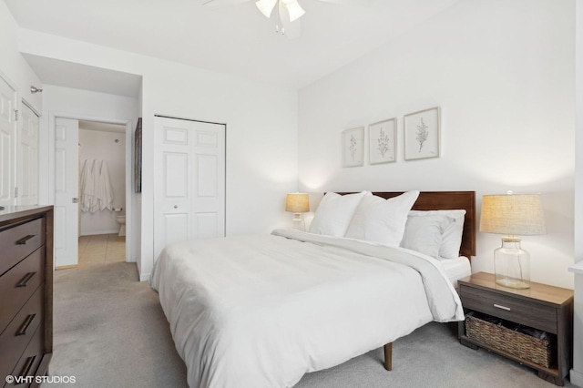 carpeted bedroom with ceiling fan and a closet