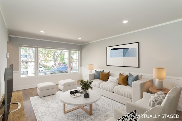 living room featuring light hardwood / wood-style flooring and ornamental molding