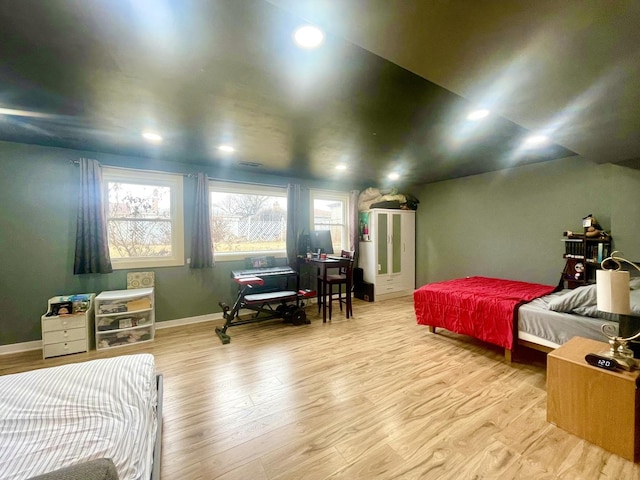 bedroom with hardwood / wood-style flooring