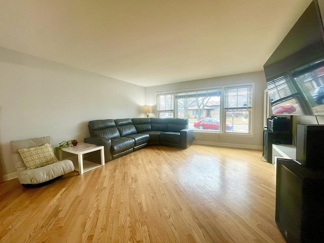 unfurnished living room with light wood-type flooring