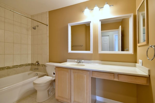 full bathroom featuring tiled shower / bath combo, toilet, tile patterned flooring, and vanity