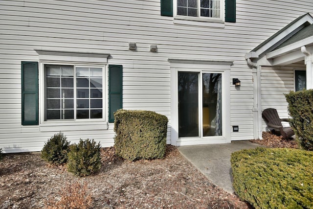 doorway to property with a patio area