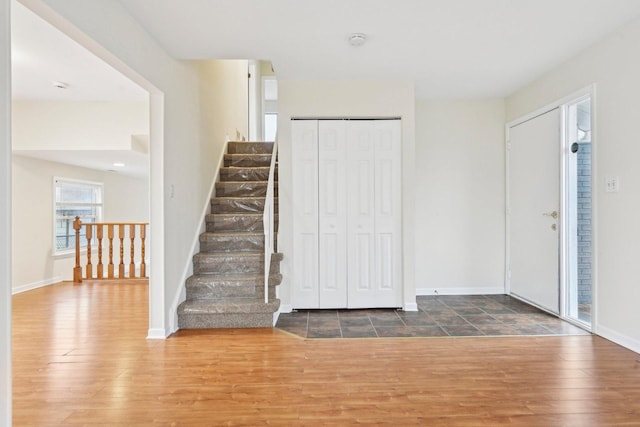 foyer with dark hardwood / wood-style floors