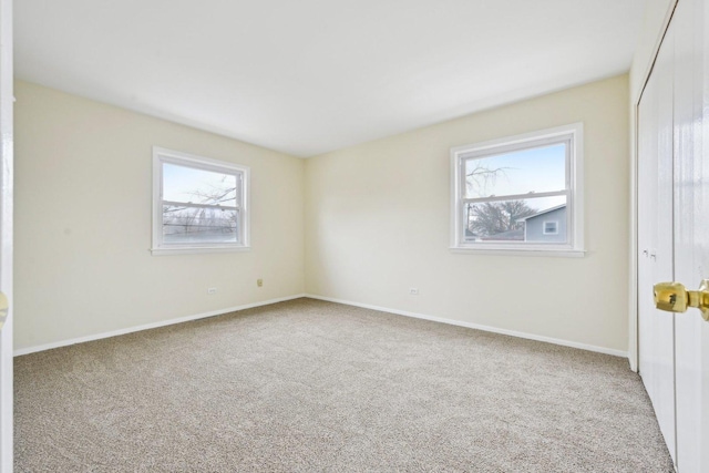 unfurnished room with carpet flooring