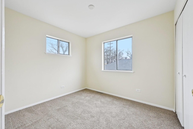 unfurnished bedroom with a closet and carpet