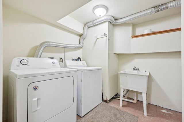 washroom with washing machine and clothes dryer