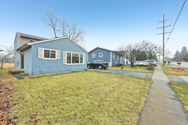 view of property exterior with a lawn