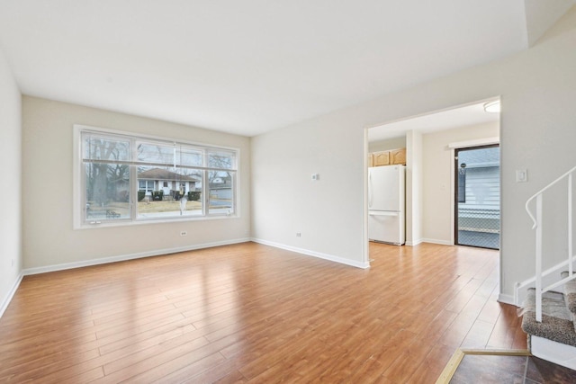 unfurnished living room featuring light wood-type flooring