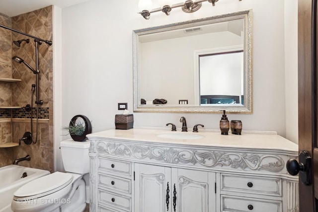 bathroom with visible vents, toilet, bathtub / shower combination, and vanity