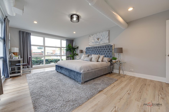 bedroom with light wood-type flooring