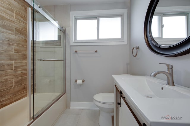 full bathroom with vanity, tile patterned floors, shower / bath combination with glass door, and toilet