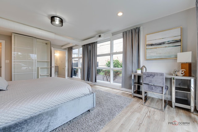 bedroom with wood-type flooring