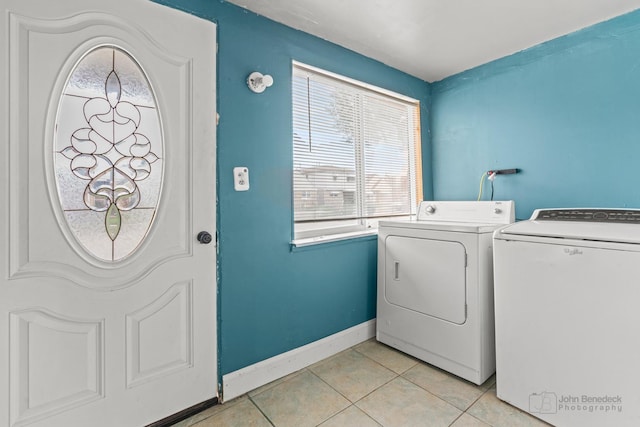 washroom featuring light tile patterned floors and washing machine and dryer